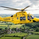 Yellow helicopter search and rescue emergency operations UK